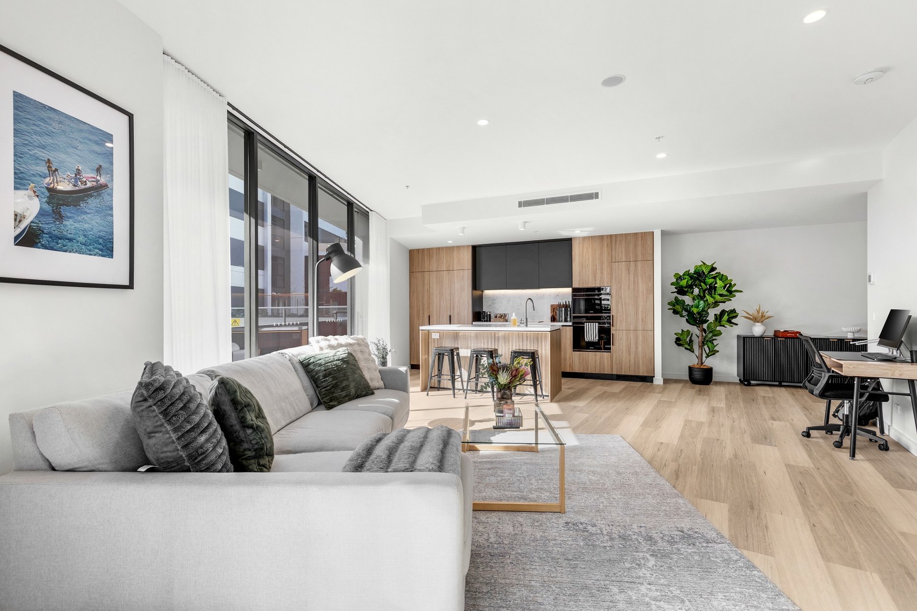 Managed Newcastle apartment living area and kitchen